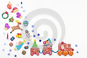 Christmas background with decorations. Santa, Christmas train with tree and sweets, snowman, reindeer and gifts on white