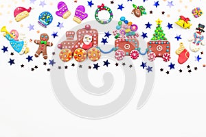 Christmas background with decorations. Santa, Christmas train with tree and sweets, snowman, reindeer and gifts on white