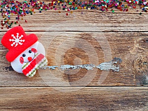 Christmas background decorations with Snowman and gift boxes on the old wood board by Flat lay, top view and copy space