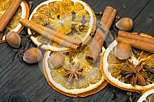 Christmas background: dried orange, cinamon, hazelnut, anise and cloves