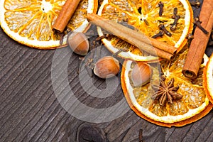 Christmas background: dried orange, cinamon, hazelnut, anise and cloves