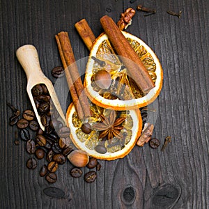 Christmas background: dried orange, coffee beans, cinamon, anise and cloves