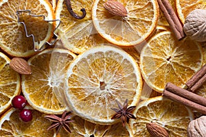 Christmas background of dried oranges, anise, cinnamon and nuts