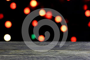 Christmas background with empty old dark wooden desk table.