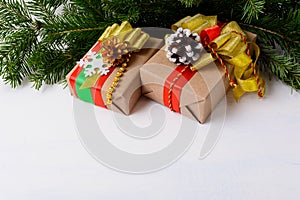Christmas background with fir branches and decorated gift boxes