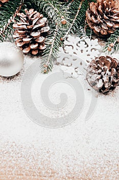 Christmas background with fir and pinecones