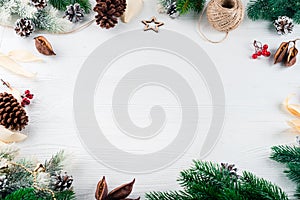 Christmas background with Christmas fir tree and candles with decoration on a wooden board. Christmas lantern