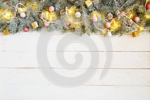 Christmas background with fir tree and decoration on white wooden board