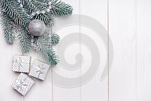Christmas background with fir tree and gift boxes. Top view, flat lay with copy space