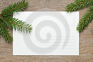 Christmas background from fir twigs on wooden table