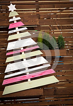 Christmas background with fir and wooden Christmas tree