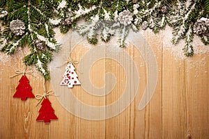 Christmas background with firtree, decorative trees and cones on