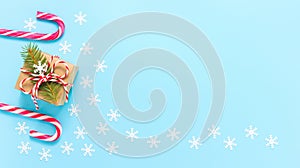 Christmas background frame with gift box, candy cane and snowflakes