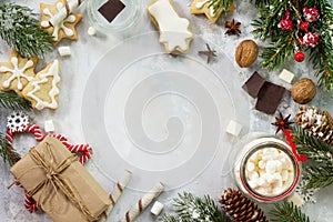 Christmas background frame or greeting xmas card. Gingerbreads and a cup of hot chocolate with a marshmallow on a festive