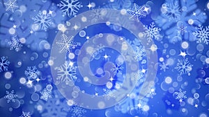 Christmas background of fuzzy and focused snowflakes