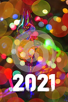 Christmas background-garlands with colorful lights on a decorated Christmas tree, bokeh, Happy New Year 2021 colored