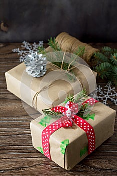 Christmas background with gift box. Christmas gifts in handmade boxes on a wooden table