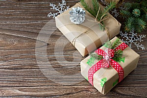 Christmas background with gift box. Christmas gifts in handmade boxes on a wooden table.