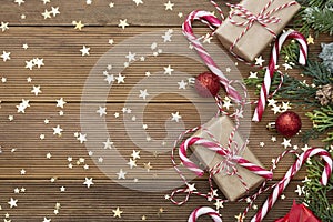 Christmas background with gift boxes, and candie canes, fir branches, winter decoration. New year concept. Copy space.