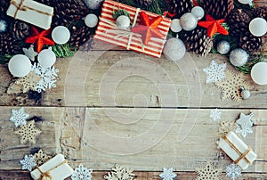 Christmas background with gift boxes and decorations on the wood