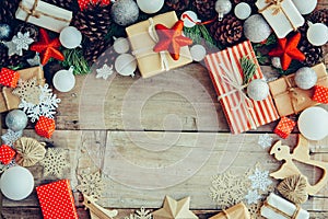 Christmas background with gift boxes and decorations on the wood