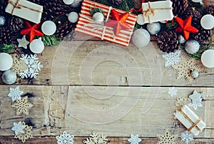 Christmas background with gift boxes and decorations on the wood