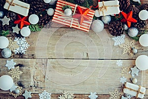 Christmas background with gift boxes and decorations on the wood