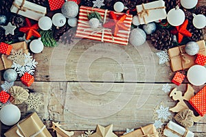 Christmas background with gift boxes and decorations on the wooden table