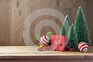 Christmas background with gift boxes and ornament on wooden tabl