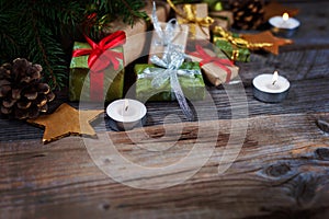 Christmas background with gift on wooden background with Fir branches. Xmas and Happy New Year composition.