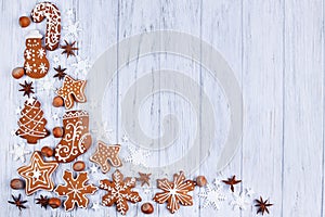 Christmas background. Gingerbread cookies, spices, hazelnuts and