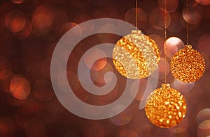 Christmas background with gold bokeh lights and christmas balls