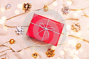 Christmas background with golden balls and present gift box and decoration on pink background