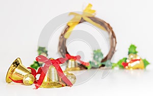 Christmas background, golden bells with red ribbon