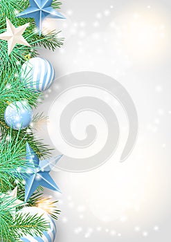 Christmas background with green branches and blue ornaments