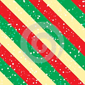 Christmas background with green, red and yellow diagonal stripes and snow. Vector seamless pattern