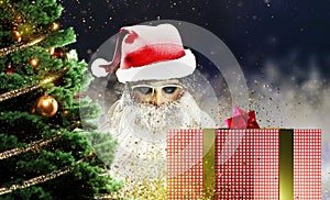 Christmas background. Greeting card design. Santa Claus with present.