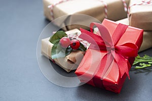 Christmas background or greeting cards, mock up with gift boxes on sleigh over gray background. Winter holidays