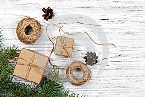 Christmas background or Holiday greeting card. christmas present box with fir tree branch and decorations on wooden