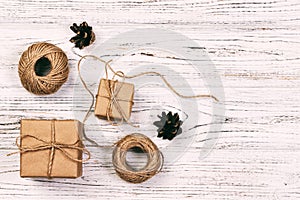 Christmas background or Holiday greeting card. christmas present box with fir tree branch and decorations on wooden