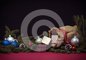 Christmas background with jute sack and gift boxes