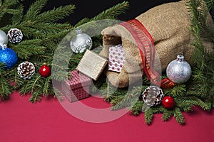 Christmas background with jute sack and gift boxes