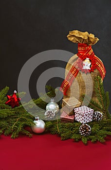 Christmas background with jute sack and gift boxes