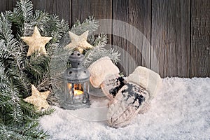 Christmas background with lantern and mittens