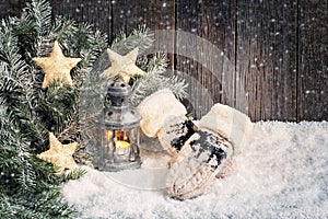 Christmas background with lantern and mittens