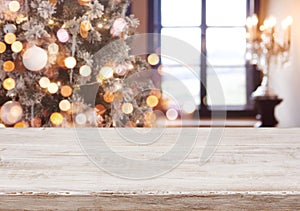 Christmas background with light spots, bokeh window and wooden tabletop