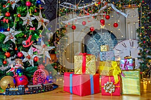 Christmas background, a lot of boxes with gifts lies near the festive Christmas tree