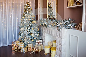 Christmas background. Luxury interior room with fireplace decorated in xmas style. No people. New year tree and gifts