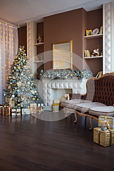 Christmas background. Luxury interior room with fireplace decorated in xmas style. No people. New year tree and gifts