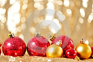 Christmas background, new year close up red and gold decoration balls on glitter abstract blurred holiday bokeh background